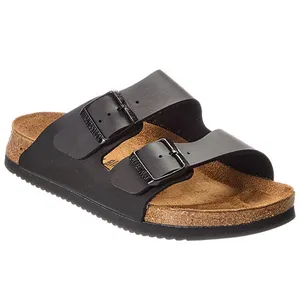 Black two-strap sandal with adjustable buckles and a cork footbed.