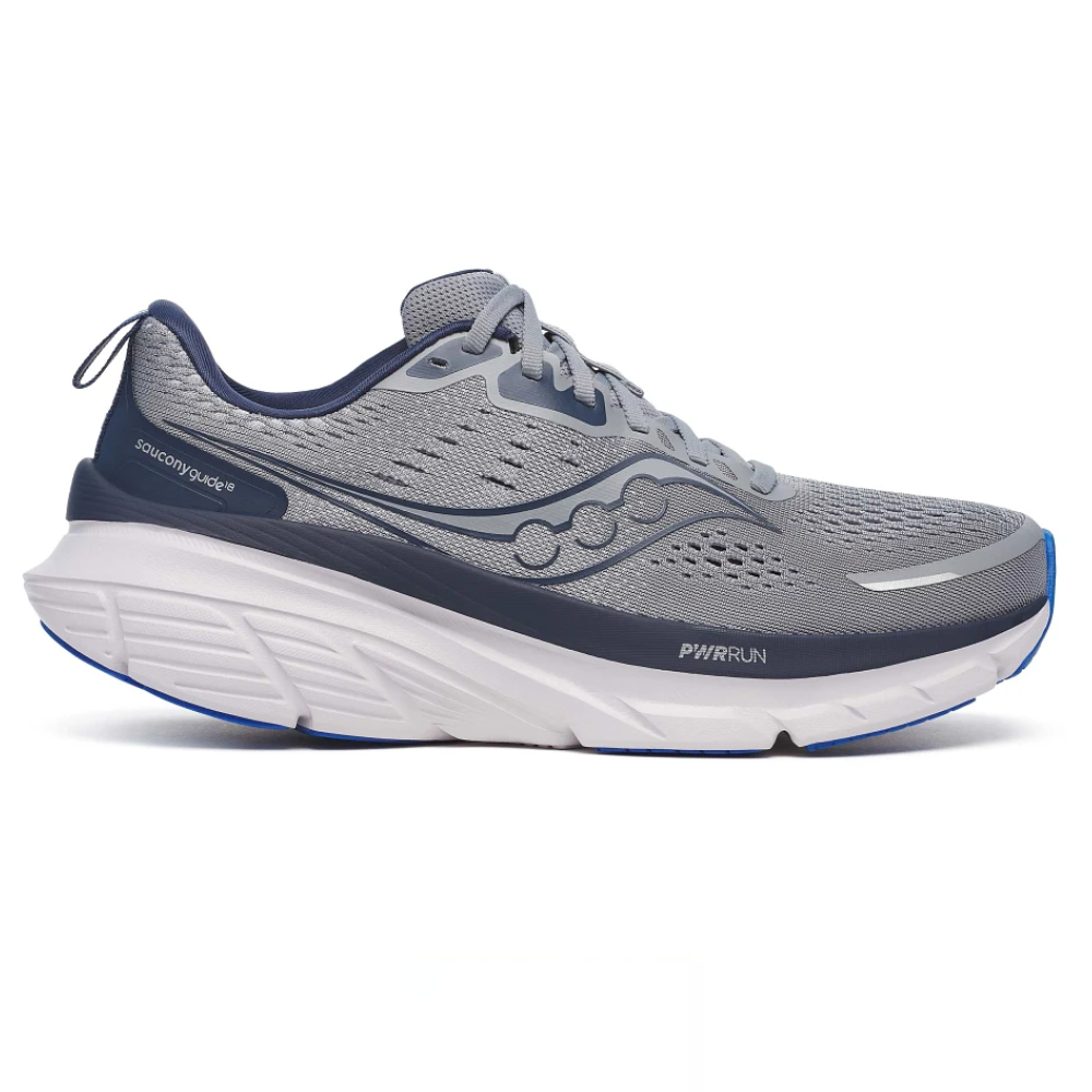 A gray and navy Saucony running shoe with a thick white midsole and PWRRUN cushioning, featuring breathable mesh upper and a blue outsole.