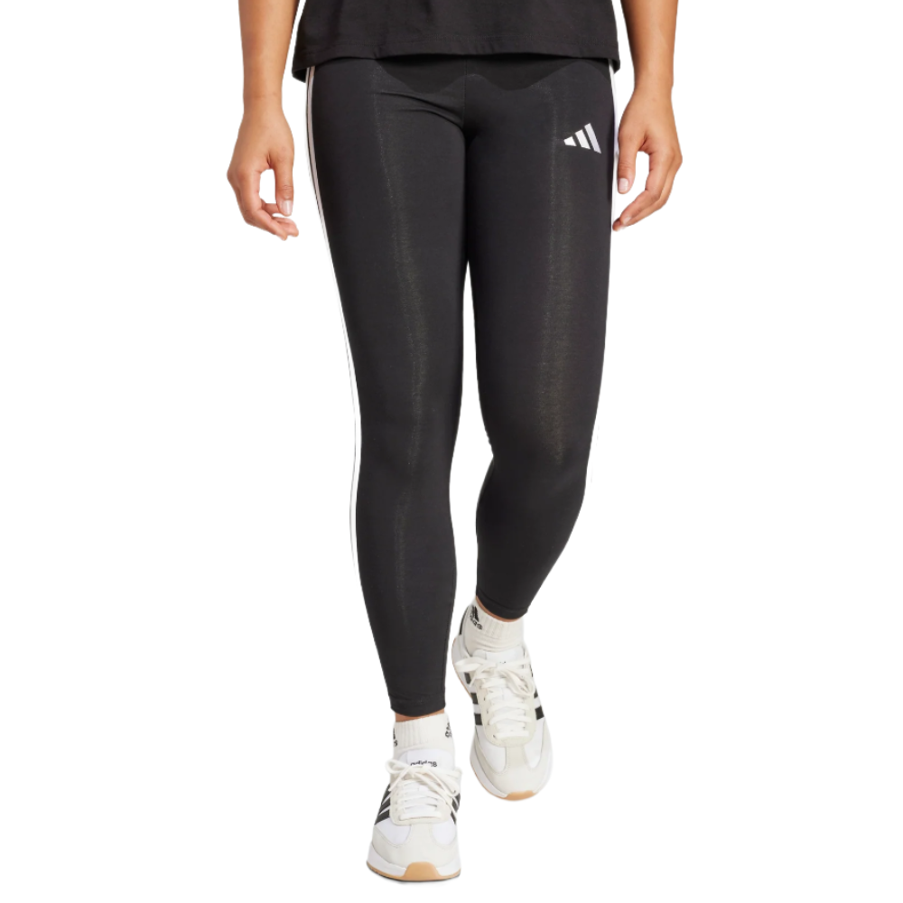 Black leggings and white sneakers with logo details, worn by a person.