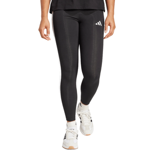 Black leggings and white sneakers with logo details, worn by a person.