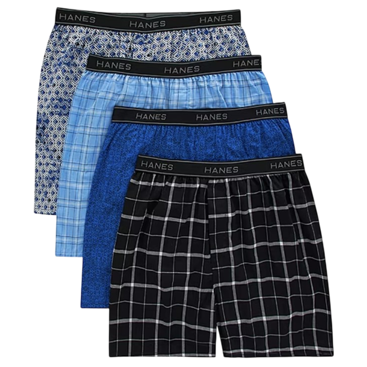 Four pairs of Hanes men's boxers in various shades of blue and black, each with different patterns such as checkered and geometric designs, featuring elastic waistbands with the Hanes logo.