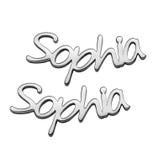 Two chrome-finished name emblems featuring the name \“Sophia\“ in a cursive font.