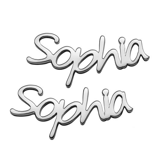 Two chrome-finished name emblems featuring the name \“Sophia\“ in a cursive font.