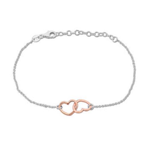 A delicate bracelet with a silver chain features two interlocking heart outlines, one in rose gold, creating a minimalist and elegant design.