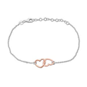 A delicate bracelet with a silver chain features two interlocking heart outlines, one in rose gold, creating a minimalist and elegant design.