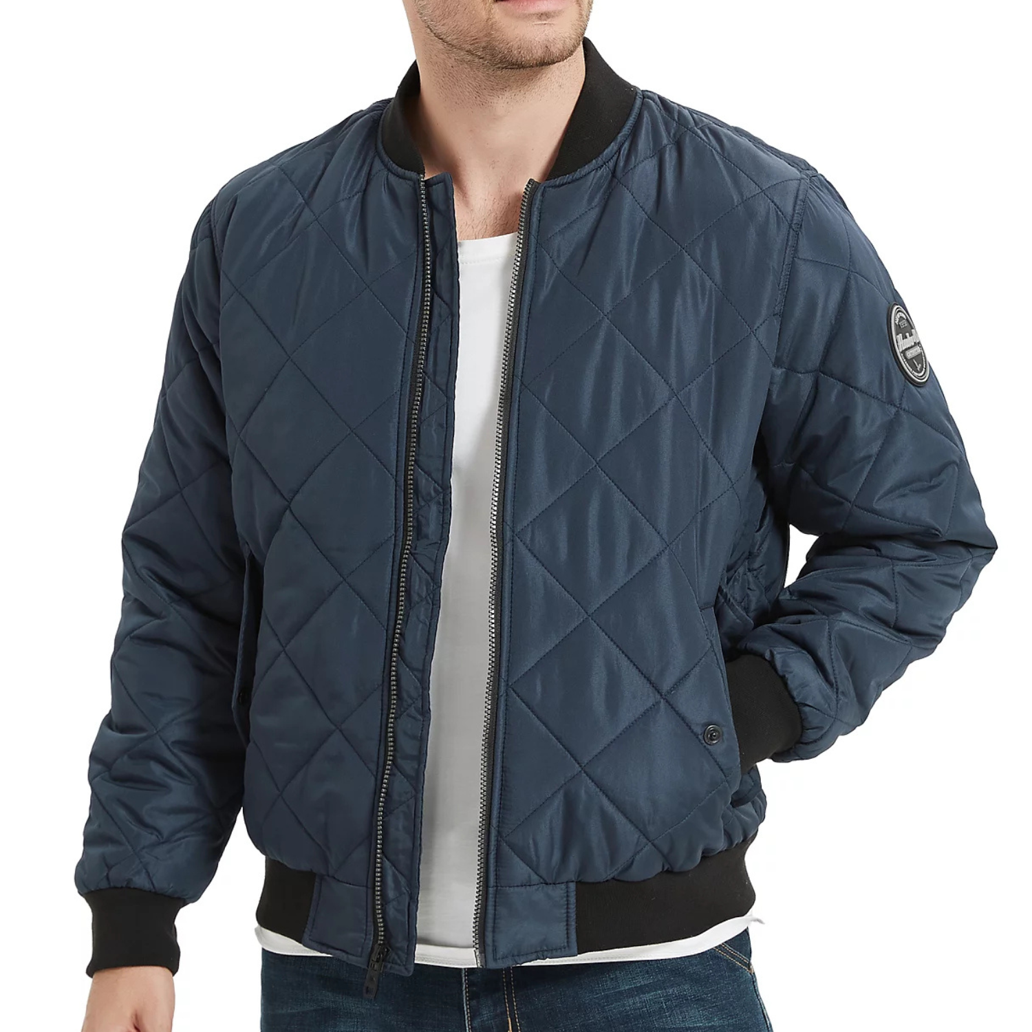 A navy blue quilted bomber jacket by Hawke & Co. featuring a zip front, black ribbed collar and cuffs, and a logo patch on the left sleeve.