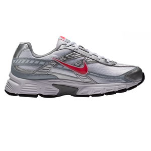 A silver and gray athletic shoe with a red Nike swoosh, featuring a white midsole and black outsole for running or casual wear.