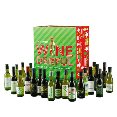 An advent calendar with 24 miniature bottles of various wines, including red, white, and rosé options, presented in front of a festive green and red box.