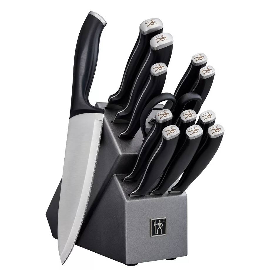 A J.A. Henckels knife set consisting of various knives with black handles inserted neatly into a grey block marked with the Henckels logo.