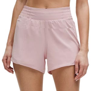 High-waisted pink athletic shorts with a wide, ribbed waistband and curved hems.
