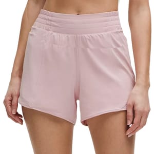 High-waisted pink athletic shorts with a wide, ribbed waistband and curved hems.
