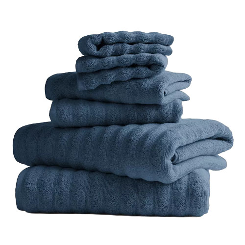 A stack of blue bath towels in various sizes, neatly folded and displayed.