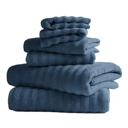 A stack of blue bath towels in various sizes, neatly folded and displayed.