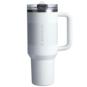 40oz Stanley Flip Straw Tumbler, white, features a durable handle, flip straw lid, and textured grip. Designed for easy carrying and sipping.