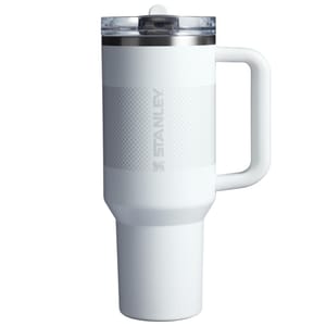 40oz Stanley Flip Straw Tumbler, white, features a durable handle, flip straw lid, and textured grip. Designed for easy carrying and sipping.