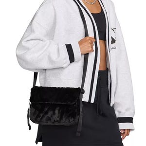 Nike Faux-Fur Crossbody Bag with a plush, fur-like texture in black, adjustable strap for versatile wear, and a casual, chic style ideal for casual or sporty outfits.