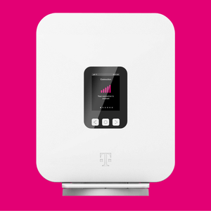 A white device with a small screen displaying connection status, featuring a magenta signal icon and navigation buttons, with a logo resembling a \“T\“ below the screen.