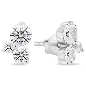 Silver stud earrings featuring three round, clear gemstones in a triangular cluster design.