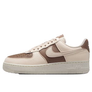 A beige and brown Nike Air Force 1 sneaker with a classic low-top design and white sole, featuring the iconic swoosh logo.