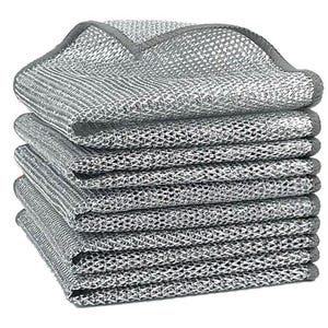 Stack of silver metallic scrub pads with a textured, mesh-like surface for cleaning purposes.