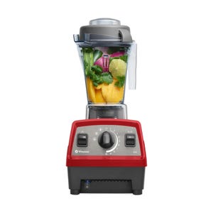 Red Vitamix S10 blender with a clear container filled with fruits and vegetables, including mango, lime, cilantro, and greens.