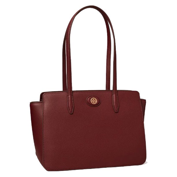 A deep red leather tote bag with two handles and a brand logo emblem centered at the top.