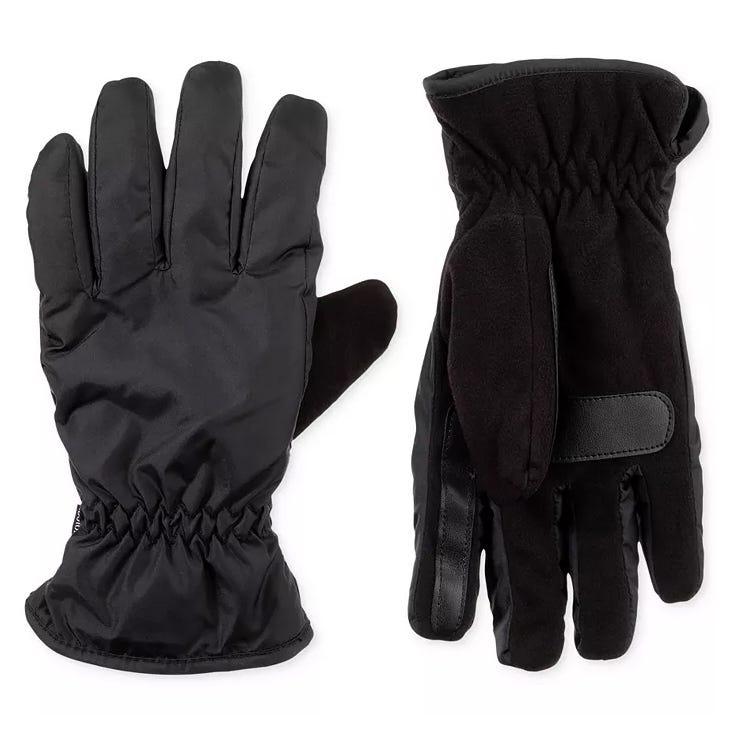 Men's Isotoner gloves are black with a combination of sleek and soft materials. They feature an elastic wrist for a snug fit and a velcro strap for additional security.