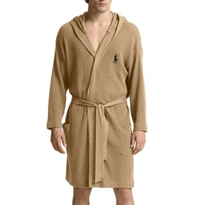 A beige waffle-knit hooded robe with a belted waist and two front pockets, featuring an embroidered logo on the chest.
