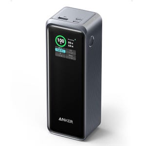 Anker 27,650mAh Power Bank with a built-in display showing charge percentage, remaining time, and power output (up to 140W). It has multiple ports for charging various devices and a sleek, rectangular design.