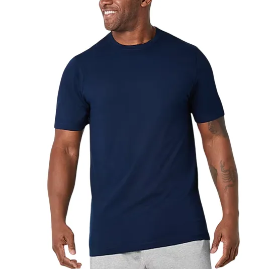 A man wearing a plain navy blue short-sleeve T-shirt and light gray shorts.