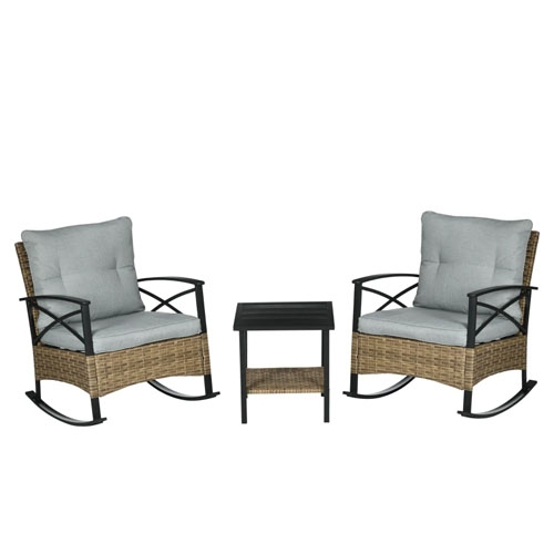 Two cushioned wicker rocking chairs and a small side table, featuring metal frames and a wicker-like finish.