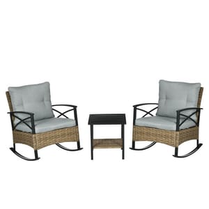 Two cushioned wicker rocking chairs and a small side table, featuring metal frames and a wicker-like finish.