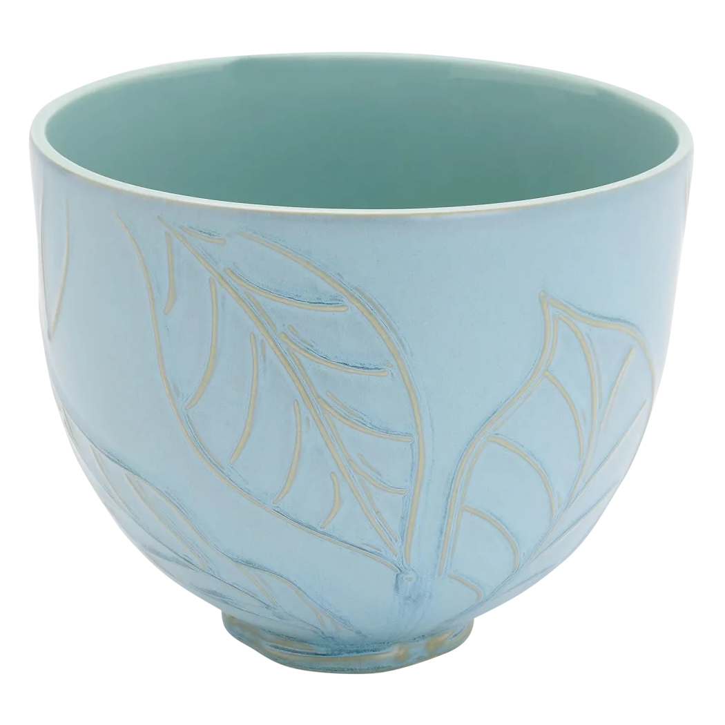 Light blue ceramic bowl with embossed leaf design.