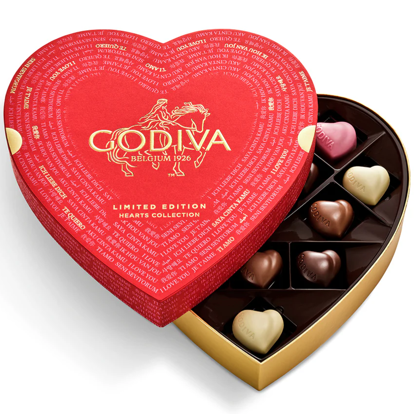 Heart-shaped box of assorted chocolates from Godiva's Limited Edition Hearts Collection. Box design features \“I Love You\“ in multiple languages and a red and gold color scheme.