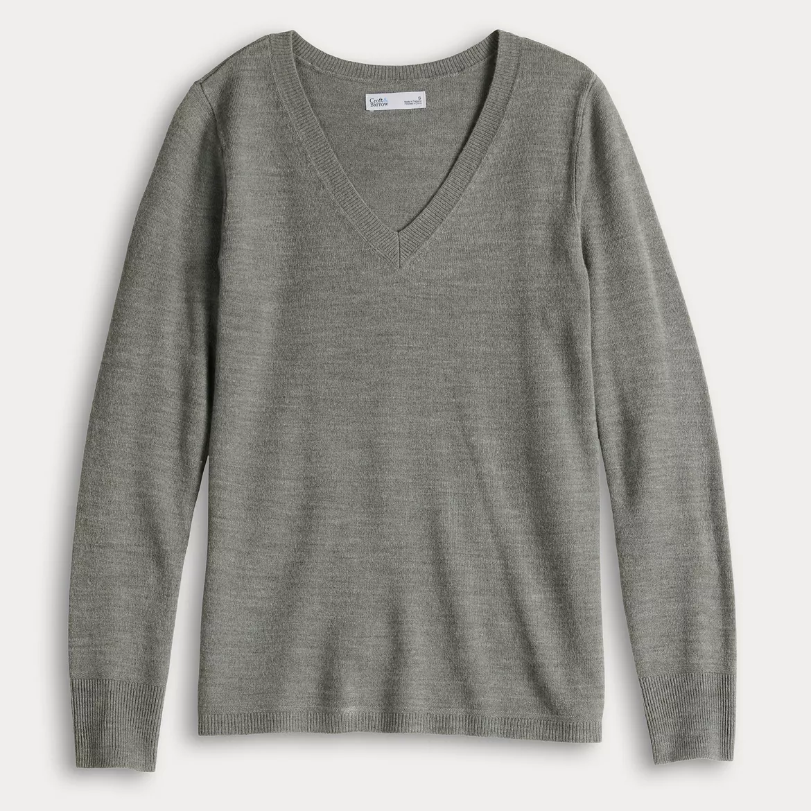 A green Croft & Barrow V-neck sweater with long sleeves and ribbed cuffs and hem.