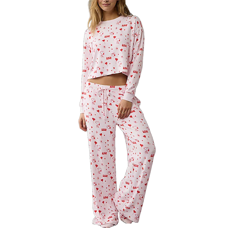 A pink long-sleeve pajamas set featuring an all-over print of red hearts and Snoopy, with the word \“Love\“ scattered throughout.