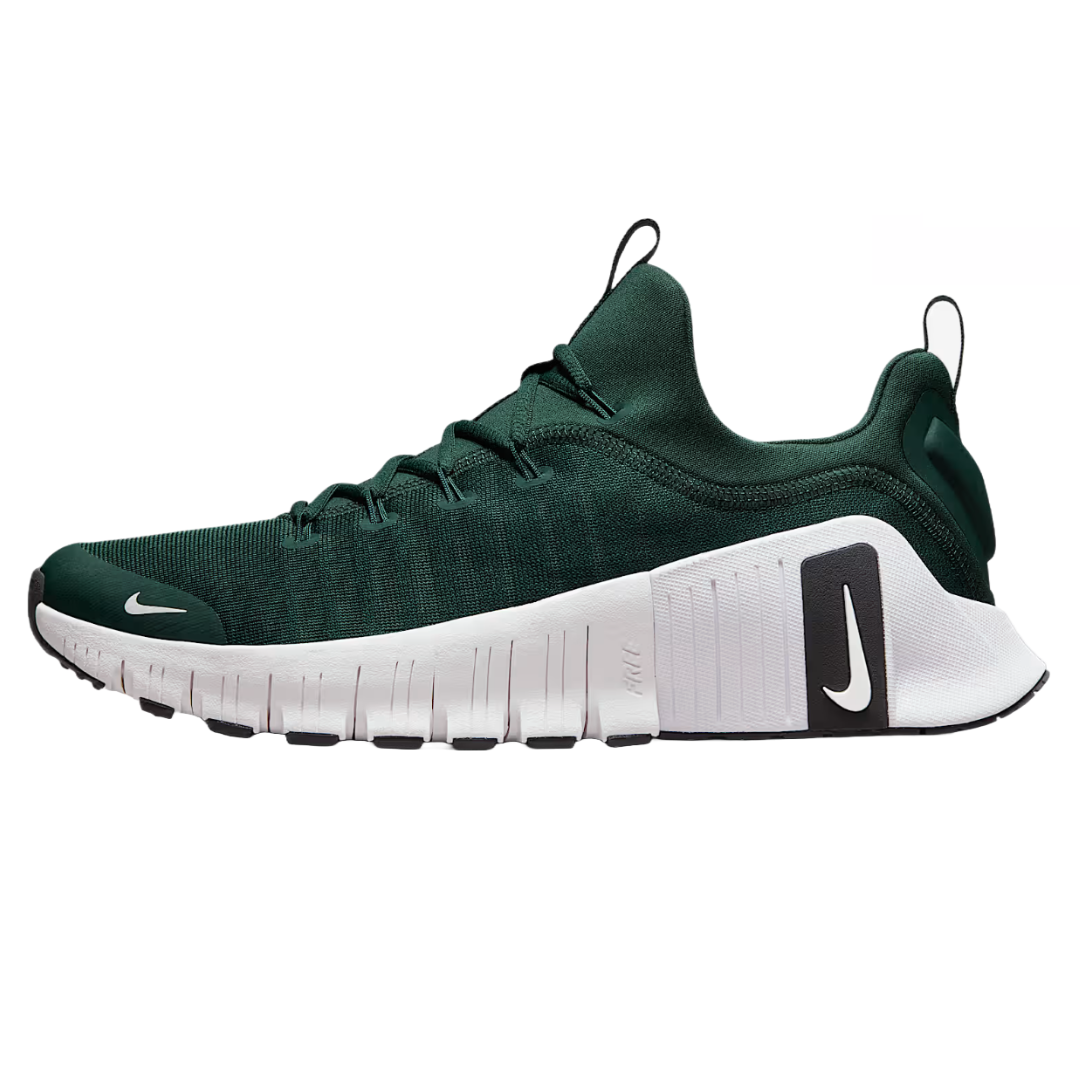 Nike Free Metcon 6 features a deep green mesh upper, loop tabs for easy pull on, and a white segmented sole for flexibility. It has a black heel section with a white Nike swoosh.