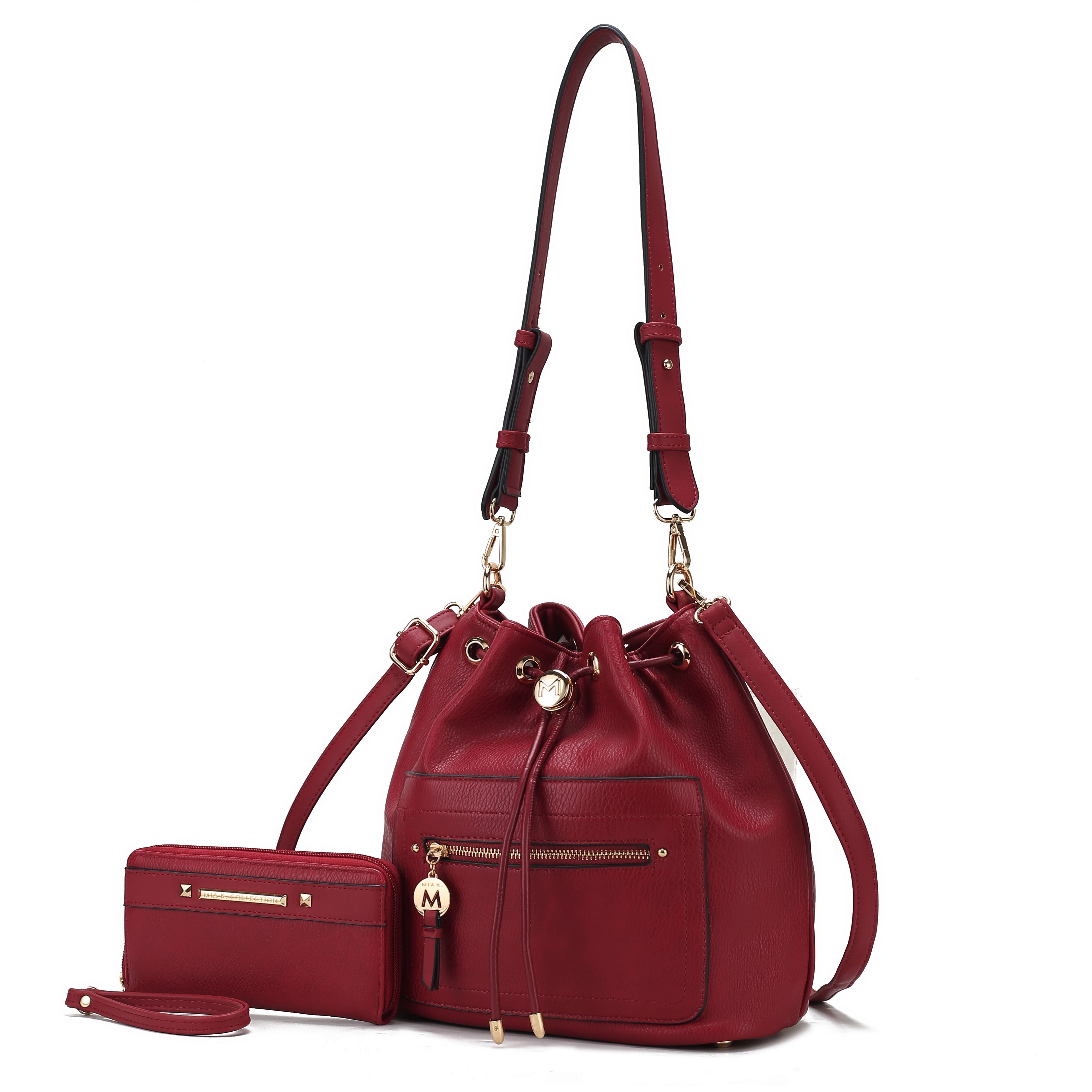 A red leather bucket bag with adjustable straps and a front zipper pocket, accompanied by a matching wallet with a zipper and strap.