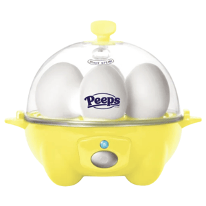 A yellow egg cooker with a transparent lid displaying three white eggs inside, featuring the Peeps logo on the center egg.