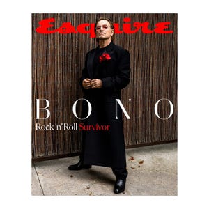 A black-clad figure with a red flower boutonniere stands confidently on the cover of Esquire magazine, featuring the headline \“BONO: Rock 'n' Roll Survivor\“ in contrasting white and red text.