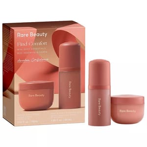 Rare Beauty Find Comfort Mini Body Essentials set includes a 2.53 fl oz (75 ml) body cream and a 1.68 fl oz (50 ml) body oil, designed to provide hydration and comfort.