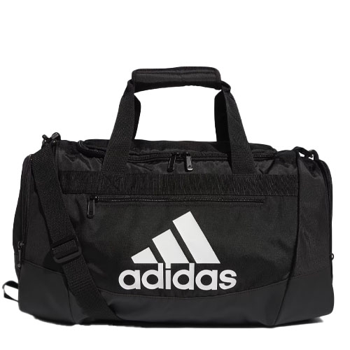 Black Adidas Defender Duffel Bag featuring a prominent white Adidas logo, with dual handles and an adjustable shoulder strap, a front zippered pocket, and a durable base.