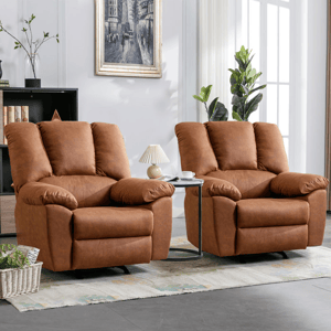 A pair of oversized rocker recliners upholstered in brown fabric with plush cushioning, wide armrests, and a cozy, inviting design, situated in a well-lit living room setting with a small side table and decorative items nearby.