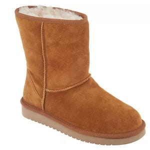 Brown suede mid-calf boots with a plush lining and a textured rubber sole.