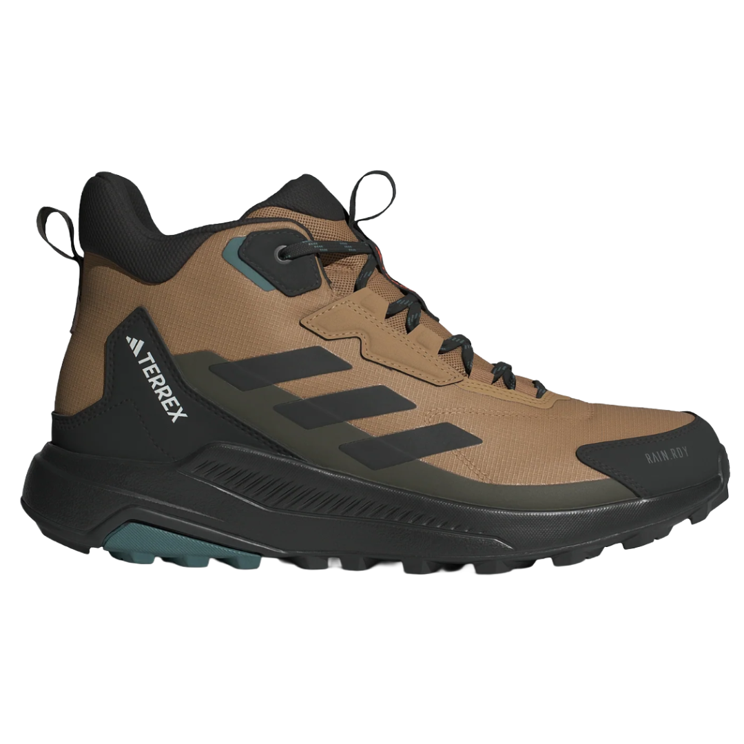 Brown hiking boot with black accents, featuring Adidas Terrex branding and designed for outdoor activities.