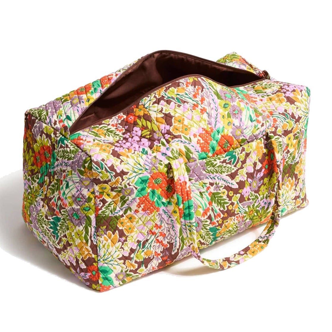 A quilted duffel bag with a colorful floral pattern and two handles, featuring an open main compartment and side pocket.