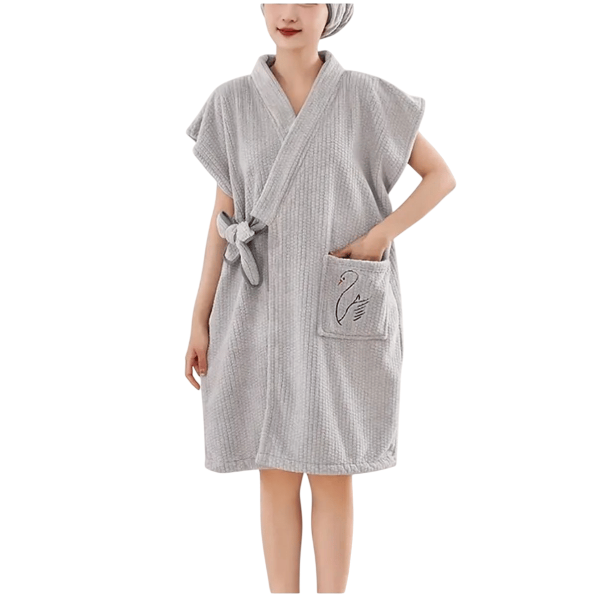 Gray bathrobe with a swan embroidery on the pocket, worn by a person in a bathroom setting.