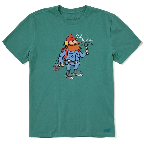 Green t-shirt featuring a cartoon character wearing winter gear, holding a pickaxe with the phrase \“Pick Kindness\“ above.