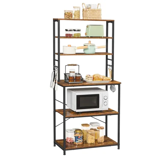 A kitchen storage rack with five wooden shelves holds various items, including jars, cookware, a microwave, and baskets. The frame is metal, offering organized space for kitchen essentials.