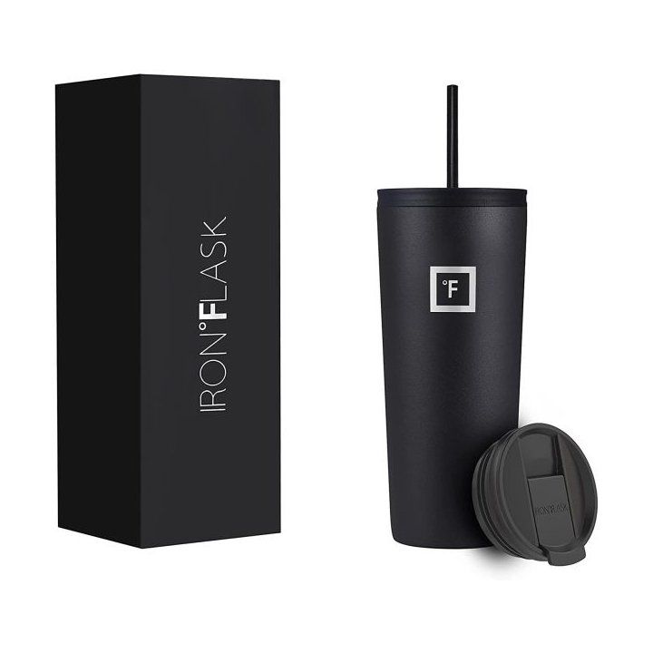 A black Iron Flask tumbler with a matching straw and an interchangeable lid is shown next to its packaging box.
